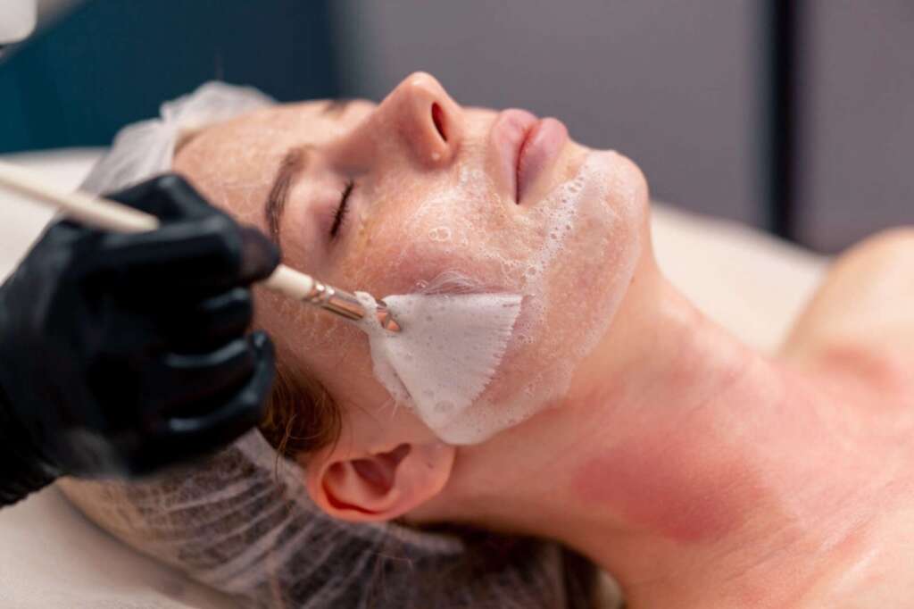 Client receiving a brightening facial at Ageless Beauty Laser & Spa